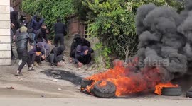 Palestinian protesters clash with Israeli forces following the funeral of Mufid Mahmud Khalil, 44, who was killed during clashes with Israeli forces, in the village of Beit Ummar north of Hebron in the West Bank