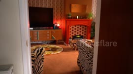 Woman transforms her house into a 1970s themed home filled with retro furniture and antiques