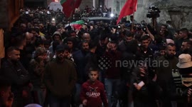 Mourners carry the body of Palestinian Mohammed Badarneh who was shot killed by Israeli forces during his funeral, in the West Bank city of Jenin.