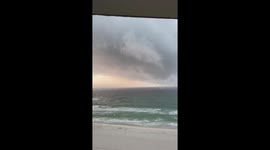 Waterspout moves ashore in Florida's Panama City Beach