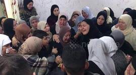 Mourners carry the bodies of Two Palestinian were killed by Israeli forces during their funeral