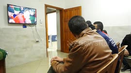 Blind Palestinian fans listen to Morocco against Canada at the Qatar World Cup