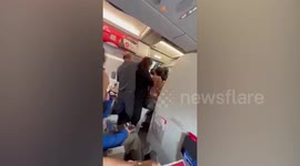 Family removed from AirAsia flight 'like criminals' after overbooking confusion
