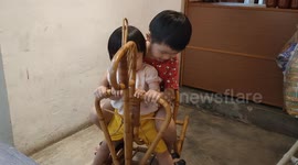 Adorable sibling riding trojan horse together