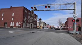 BNSF freight train passing westbound thru town hauling a string of bulk grain cars back towards Canada on the day the US senate voted to block a railroad strike.