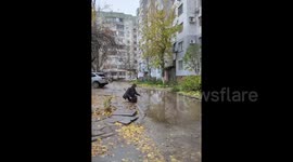 Ukrainians search puddles for water amid destroyed buildings in Kherson