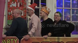 Christmas revellers in festive jumpers and Santa hats paint the town red as work party season gets underway in Birmingham