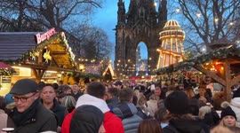 Busy Christmas market in Edinburgh and stunning light display at the castle