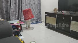 Funny toddler girl put a plastic basket on her head