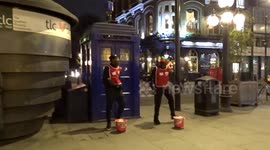 Charity workers sing and dance to Survivor to help and support young people - Earls Court