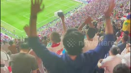 England fans inside Al Bayt Stadium celebrate after Henderson's opener