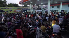 Indian people gathered at a fuel pump during Gujarat Election in India