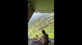 Hanging out the back of an RAF Hercules plane with the back ramp open
