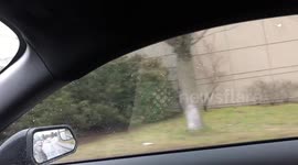 Coolest Biker Alive Rides in The Rain With a Lit Cigarette