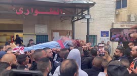 Relatives of Palestinian Omar Manna ,22, who was killed by Israeli troops mourn over his body at a hospital