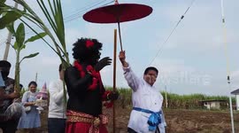 Groom wears black paint on face and body for wedding ceremony in Thailand
