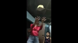 The birthday girl made fun of her cake by tossing it into the air and it did not fall!