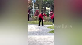 Women laugh and move like zombies during bizarre exercise in China