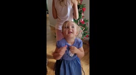 Toddler makes up some crazy Christmas dance moves!