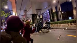 Chinese residents lift car up to rescue trapped motorist after vehicle falls off overpass