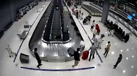 Airport staff caught on camera taking customer's backpack full of cash in Thailand