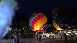 Locals fly colourful hot air balloons during annual festival in Thailand