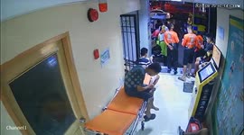 Clumsy resident falls from stretcher after being rescued from fire in the Philippines