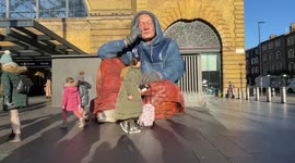 Hyper-realistic giant sculpture of homeless person unveiled in London