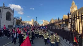 Hundreds of firefighters gather outside Houses of Parliament as representatives go in to meet MPs