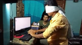 Blindfolded man typing with his mouth sets world record in India