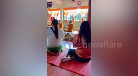 Husky dog 'meditates' with monks in Thai temple