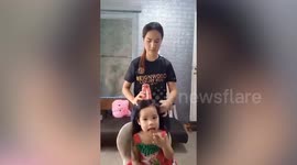 Mum uses plastic cup to make amusing 'Christmas tree' hair style for daughter