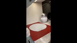 Woman makes her 7th try to separate hot isomalt from a mat; it combusts a marble counter!