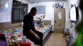 Elderly Chinese man dives to catch grandson falling off bed