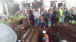 Indonesia's suicide attack: Family and friends pray at police officer's burial site