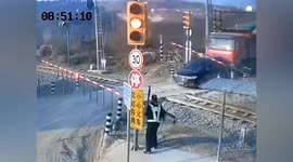 SUV drives off railway track seconds before train steams past