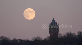 The December full Moon also known as the  cold moon rises over East London