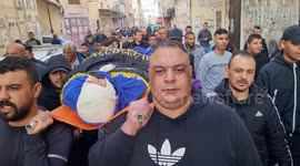 Relatives and friends carry the body of Palestinian, Tareq al-Damj, 32, killed in an Israeli army assault, during his funeral