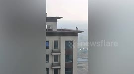 Toddler spotted walking along ledge of 28-storey high-rise