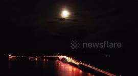 Full moon with halo illuminates over San Juanico Bridge, Philippines' second longest bridge