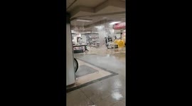 Lisbon floods: Water flowing from the roof ravages mall