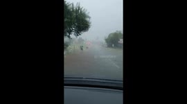 Garbage bins were swept away by floods caused by a hailstorm in South Africa.