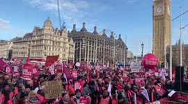 Thosands of striking Royal Mail workers stage rally outside British parliament