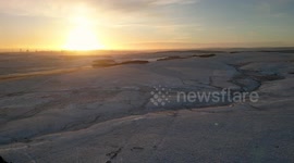 Arctic Blast aftermath: Aerial footage of sunset-and-snow covered Northumberland, England