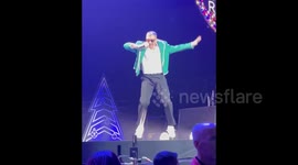 Macklemore performing at the Jingle Ball concert in Detroit, MI, USA