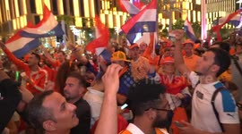 Netherlands fans walking and dancing on the way to the Lusail stadium, Doha, Qatar
