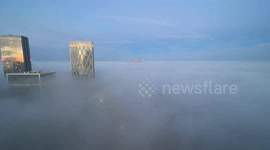 Canary Wharf skyscrapers peek through freezing fog in impressive timelapse video