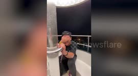 Tourists caught on Ferris wheel when thunderstorm battered park in the Philippines