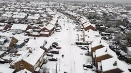 Drone footage shows Cheltenham covered by layer of heavy snow