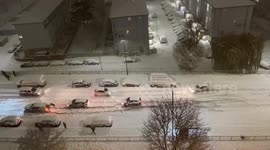 Motorists push cars, abandon vehicles in London's Enfield, creating traffic jams